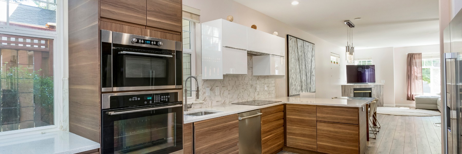 Modern kitchen with wood-grain cabinets and stainless appliances