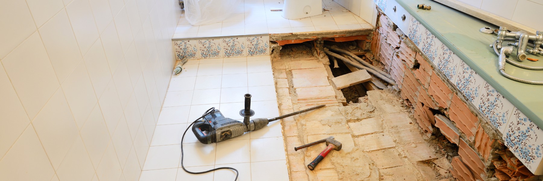 Bathroom floor torn out down to the plumbing during a renovation